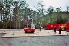 drillers standing on drilling containment pad