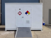 Hazmat chemical storage building with single man door from Polystar Containment