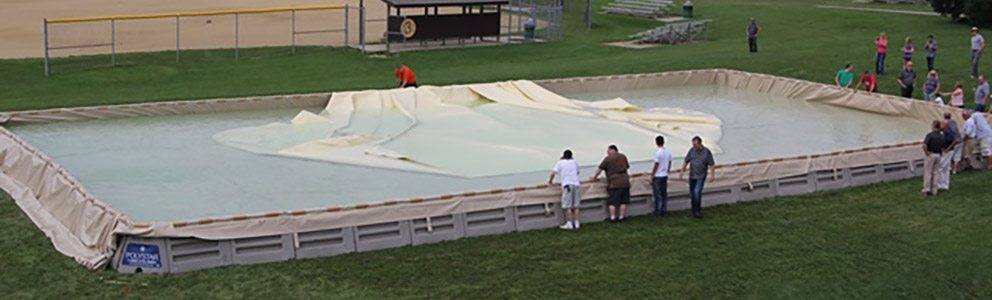 fuel bladder containment being filled on containment pad