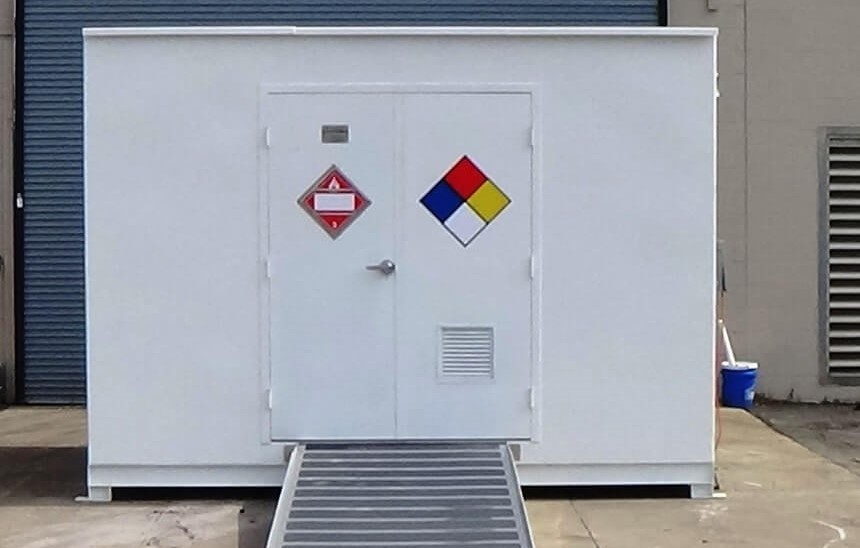 Hazmat chemical storage building with single man door from Polystar Containment