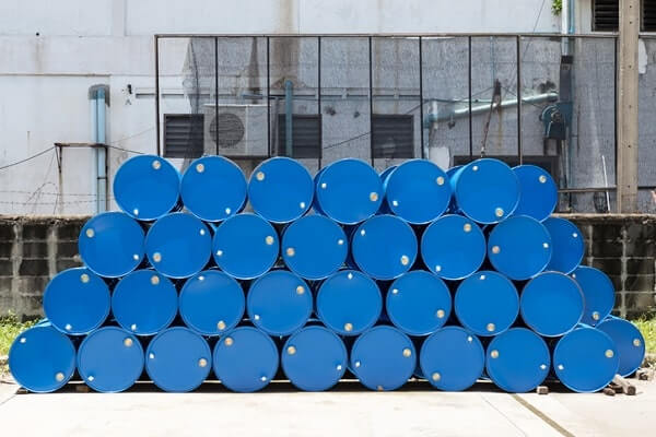 Stack of blue oil barrels that require a spill prevention plan